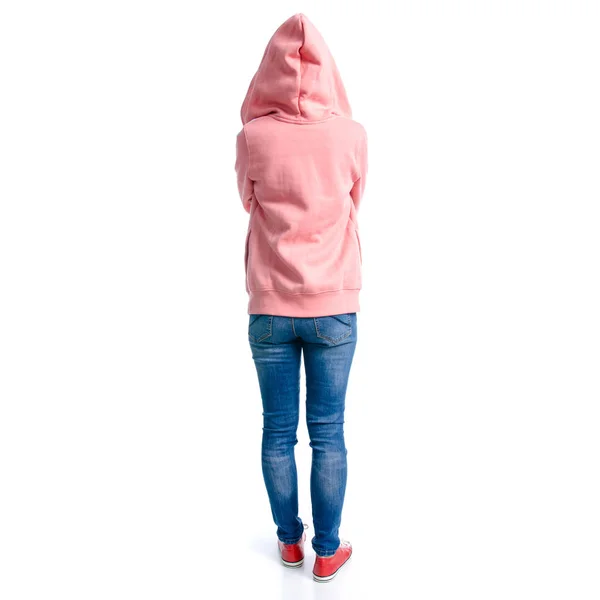 Woman in jeans and pink hoodie, sneakers standing — Stock Photo, Image