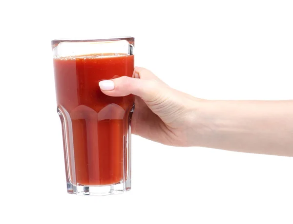 A glass of tomato juice in hand — Stock Photo, Image