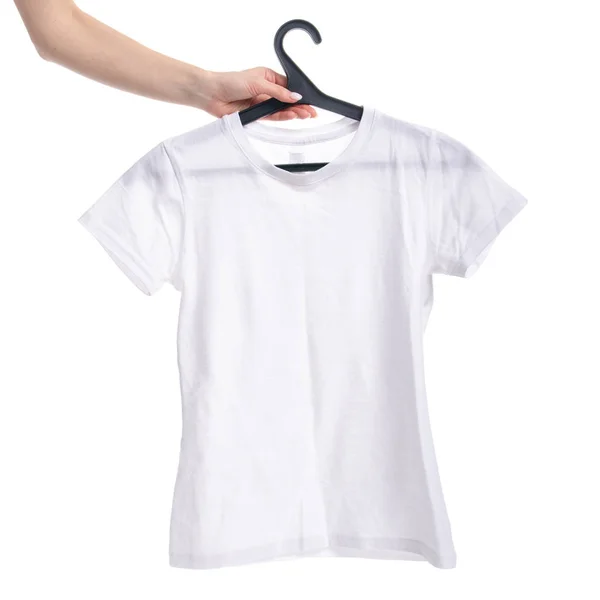 White t-shirt on a hanger in hand — Stock Photo, Image