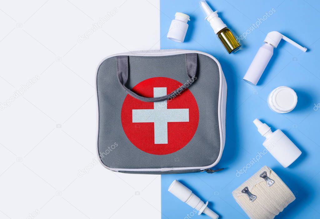 Flat lay composition with first aid kit color blue white on background, flat lay, top view