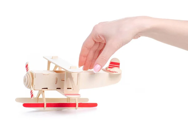 Constructor de madera modelo avión en mano — Foto de Stock
