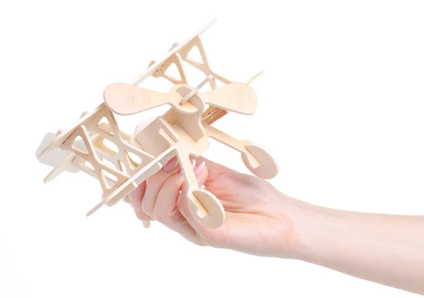 wooden constructor model airplane in hand
