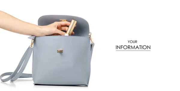 A hand put cosmetic in the female blue gray leather handbag pattern — Stock Photo, Image