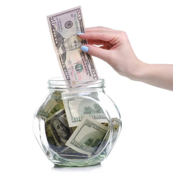 Pieniądze dolarów banknotów w szklanym słoiku, ręcznie umieścić pieniądze — Zdjęcie stockowe