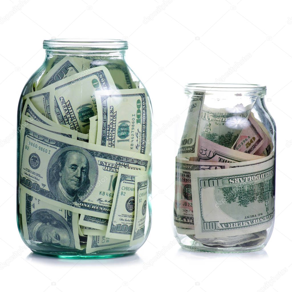 Money dollars bank notes in glass jar isolated