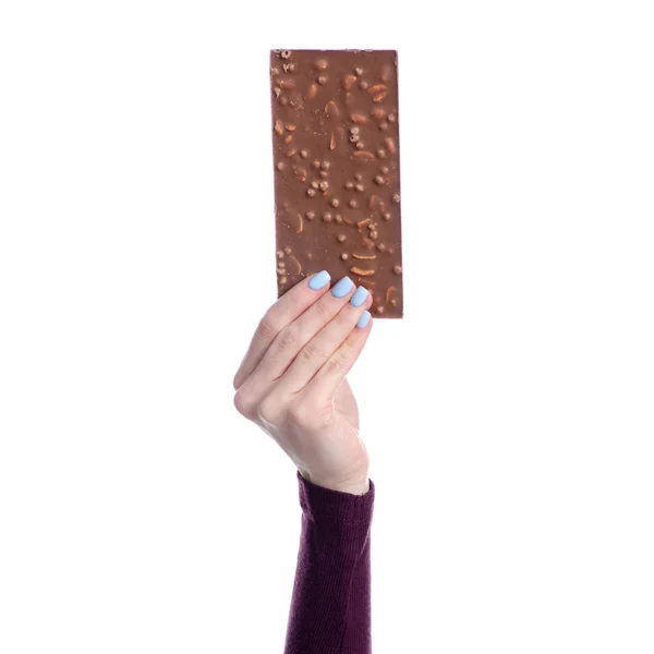 Schokolade mit Nüssen in der Hand — Stockfoto