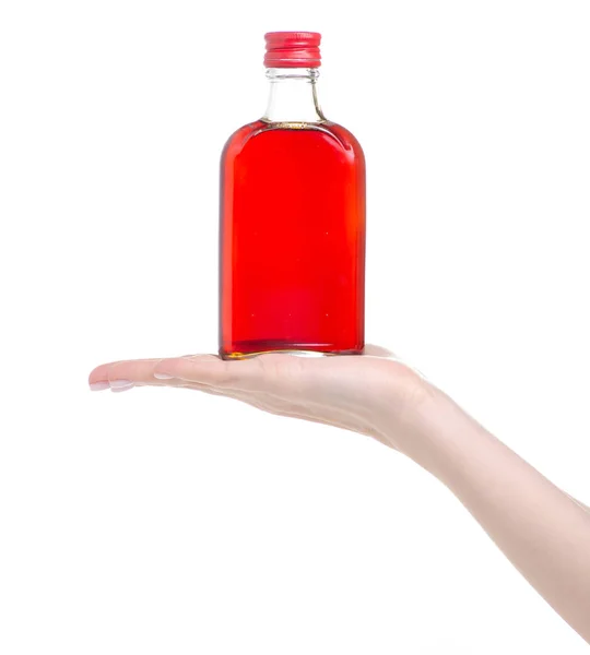 Bottle rosehip syrup in hand — Stock Photo, Image