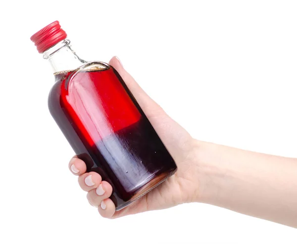 Flasche Hagebuttensirup in der Hand — Stockfoto