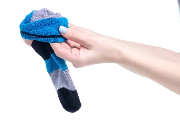 Paar blauw grijs zwart sok in hand — Stockfoto