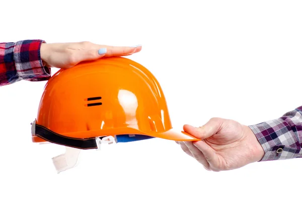 Hand geven helm bij de hand — Stockfoto