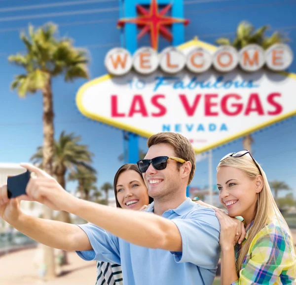 Group of happy friends taking selfie by cell phone — Stock Photo, Image