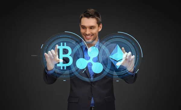 Hombre de negocios con hologramas criptomoneda —  Fotos de Stock
