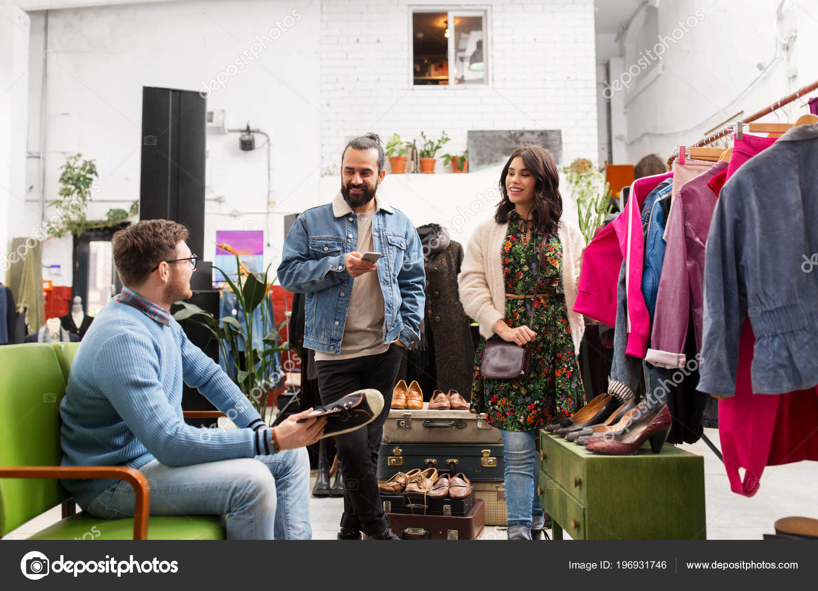 Friends choosing clothes at vintage clothing store — Stock Photo