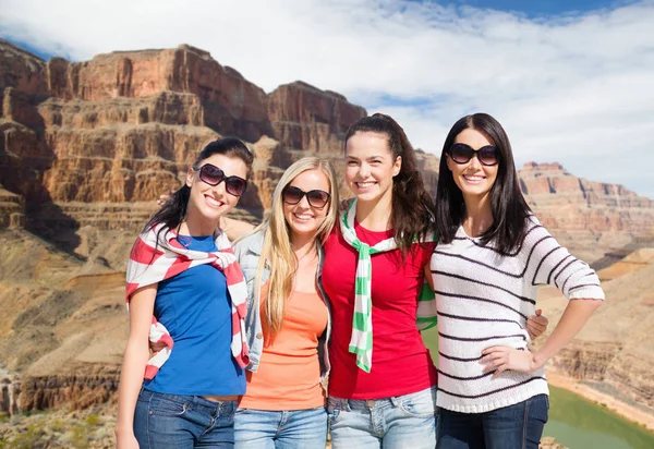 Teenage girls or young women over grand canyon — Stock Photo, Image
