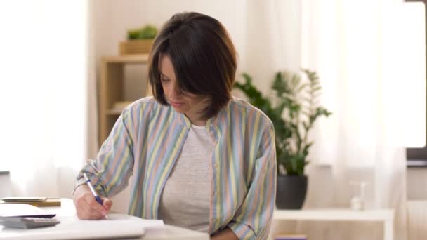 Working mother with baby boy at home office — Stock Video