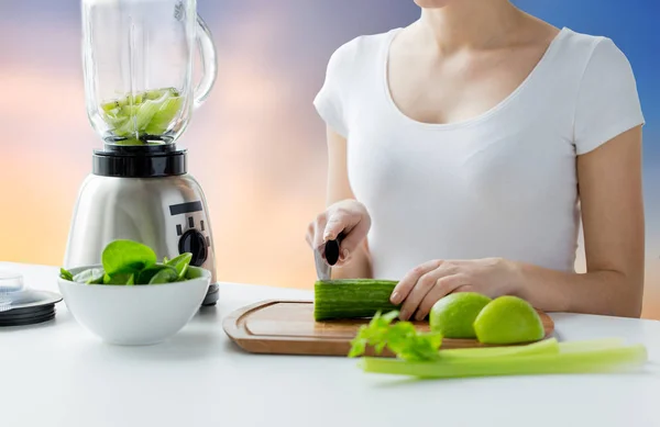 Close up of woman with blender chopping vegetables — Stock Photo, Image