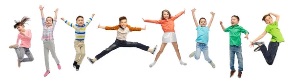 Happy kids jumping in air over white background — Stock Photo, Image