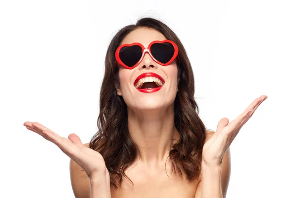 Woman with red lipstick and heart shaped shades — Stock Photo, Image