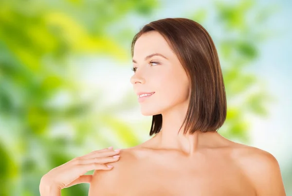 Beautiful bare woman over green natural background — Stock Photo, Image