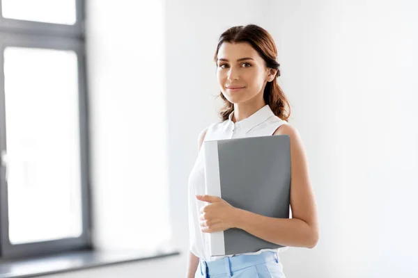 Businesswoman or realtor with folder at office — Stock Photo, Image