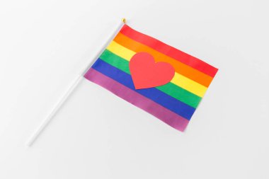 red heart on rainbow flag over white background clipart