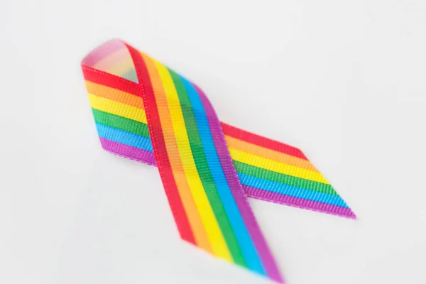 Close up of gay pride awareness ribbon on white — Stock Photo, Image