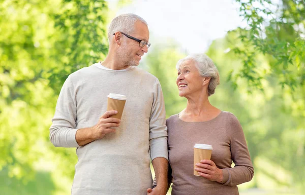Senior couple with coffee cups natural background — Stock Photo, Image