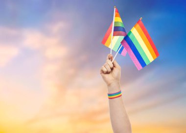 hand with gay pride rainbow flags and wristband clipart
