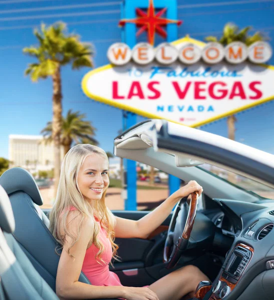 Happy woman driving convertible car at las vegas — Stock Photo, Image