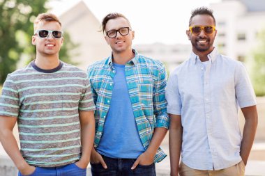 happy young men in sunglasses outdoors clipart