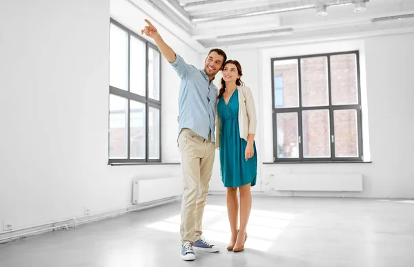 Happy couple hugging at new home — Stock Photo, Image