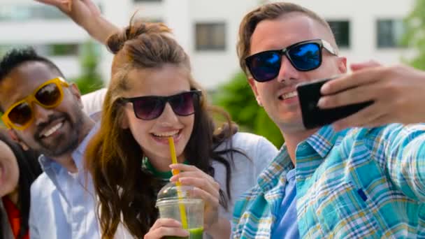 Friends taking selfie by smartphone in city — Stock Video