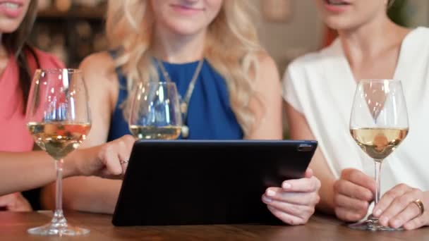 Women with tablet pc at bar wine or restaurant — Stock Video