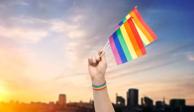 hand with gay pride rainbow flags and wristband clipart