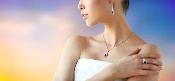 Beautiful woman with earring, ring and pendant — Stock Photo, Image