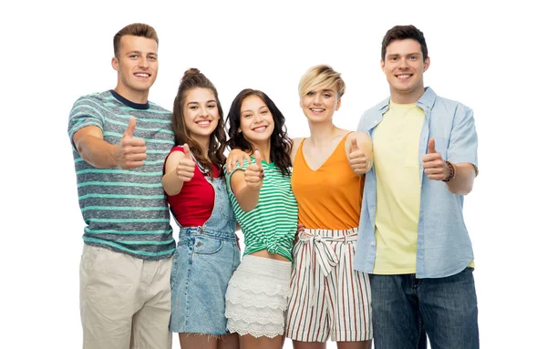 Happy friends showing thumbs up and hugging — Stock Photo, Image