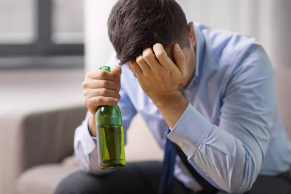 Male alcoholic drinking beer at home — Stock Photo, Image