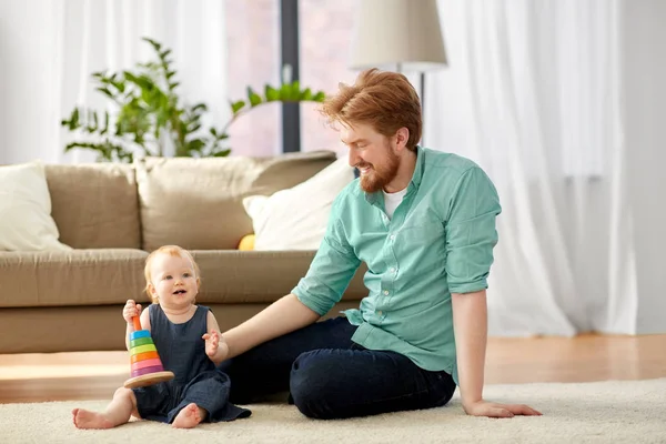 Father playing with little baby daughter at home — Stock Photo, Image