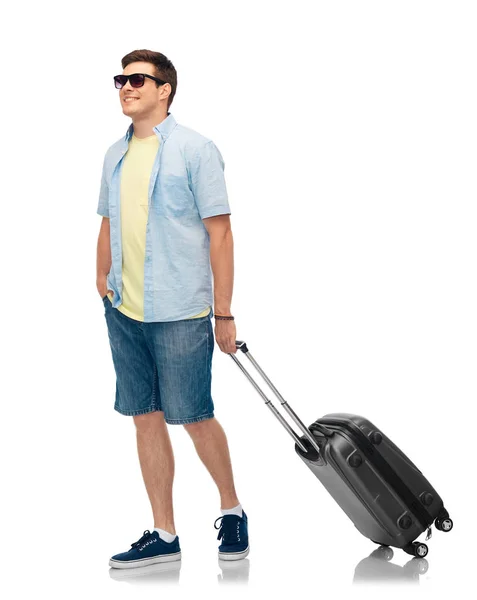 Man in sunglasses with travel bag — Stock Photo, Image