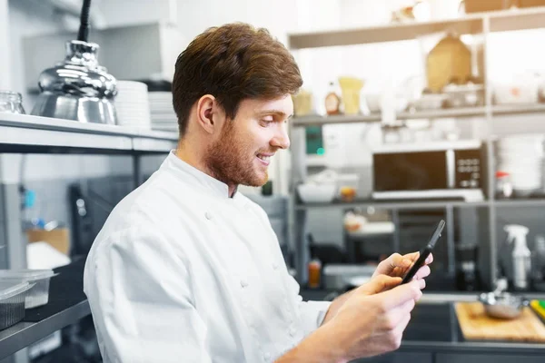 Chef cook with tablet pc at restaurant kitchen — Stock Photo, Image