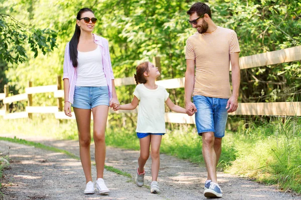 Happy family walking in summer park — Stock Photo, Image