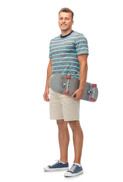 Smiling young man with skateboard over white — Stock Photo, Image