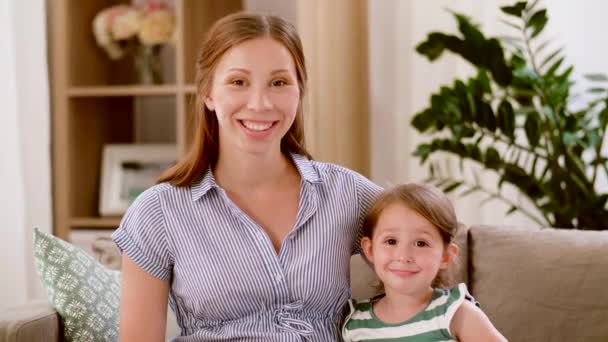 Portrait of pregnant mother and daughter at home — Stock Video