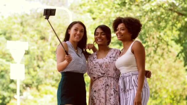 Women taking selfie by smartphone in city — Stock Video