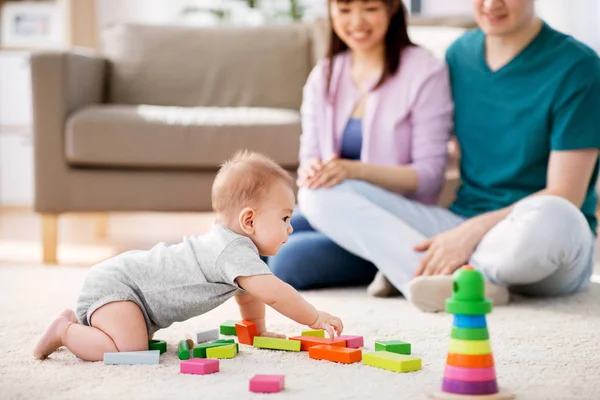 Happy family with baby boy playing at home — Stock Photo, Image