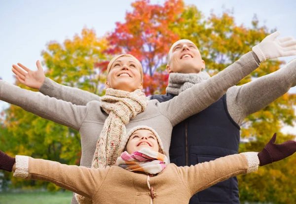 Happy family over autumn park background — Stock Photo, Image