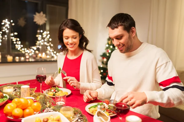 Happy couple eating at christmas dinner — Stock Photo, Image