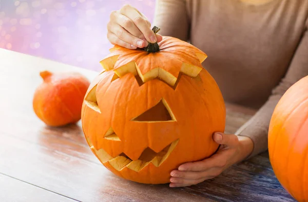 Close up of woman with halloween pumpkin — Stock Photo, Image