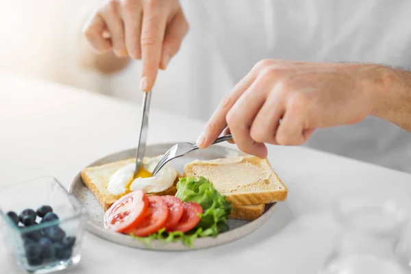 Close up of man having tasts for breakfast — стоковое фото