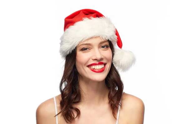 Frau mit rotem Lippenstift in Weihnachtsmütze zu Weihnachten — Stockfoto